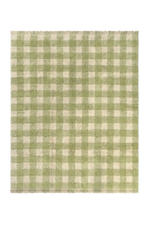 Alfombra lavable Vichy de Lorena Canals con cuadros en matcha y tono natural y flecos en los extremos.